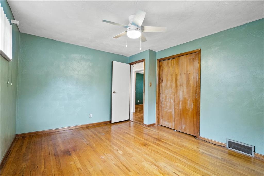 130 Hidden Hill Road Sarver, PA 16055 - Photo 13 of 36 a view of an empty room with wooden floor and a window