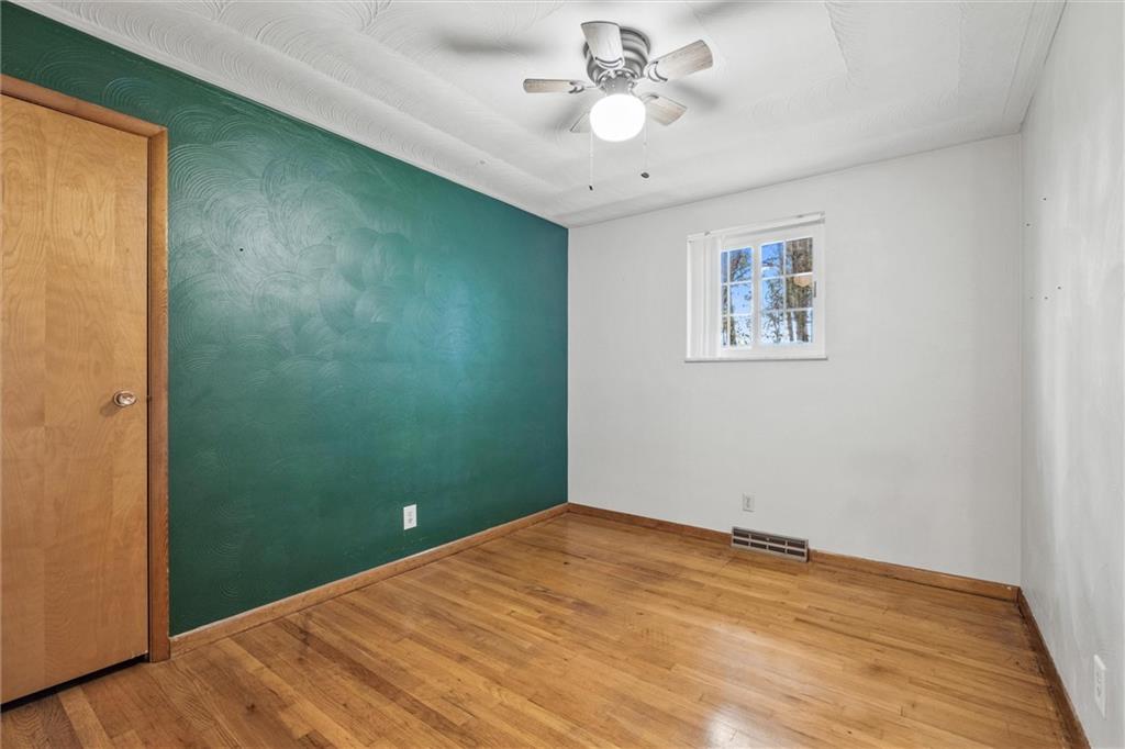 130 Hidden Hill Road Sarver, PA 16055 - Photo 14 of 36 wooden floor in an empty room with a window