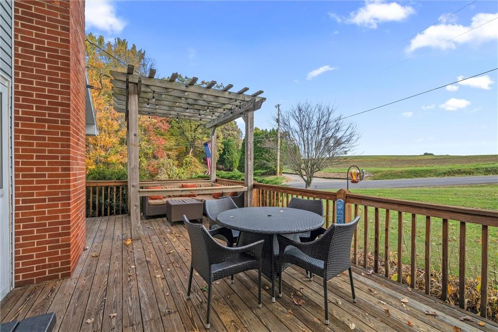 130 Hidden Hill Road Sarver, PA 16055 - Photo 18 of 36 a view of a balcony with furniture and wooden floor
