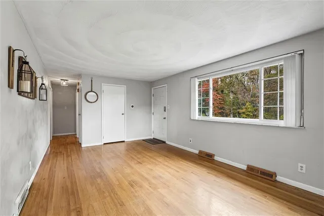 a view of an empty room with a window