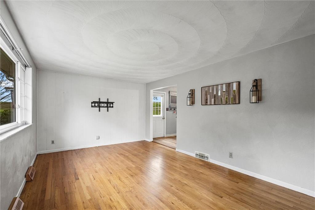 130 Hidden Hill Road Sarver, PA 16055 - Photo 3 of 36 a view of a big room with wooden floor and windows