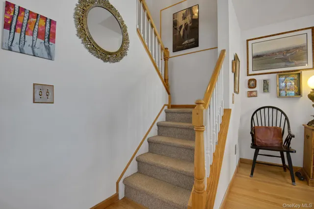 a view of staircase with wooden floor and a potted plant