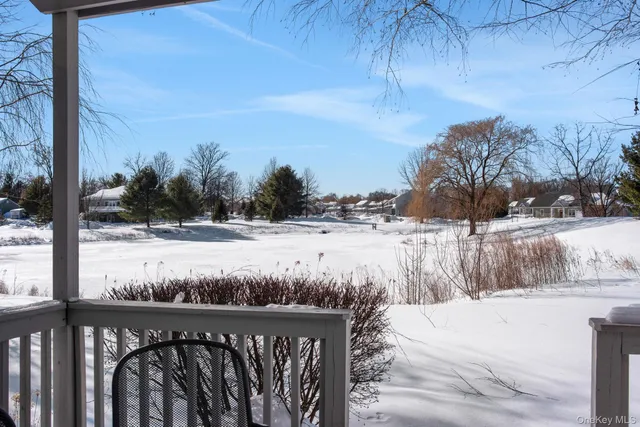 a view of swimming pool with a yard
