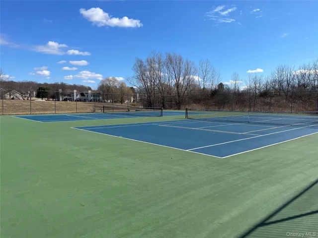 a view of an outdoor space and tennis court