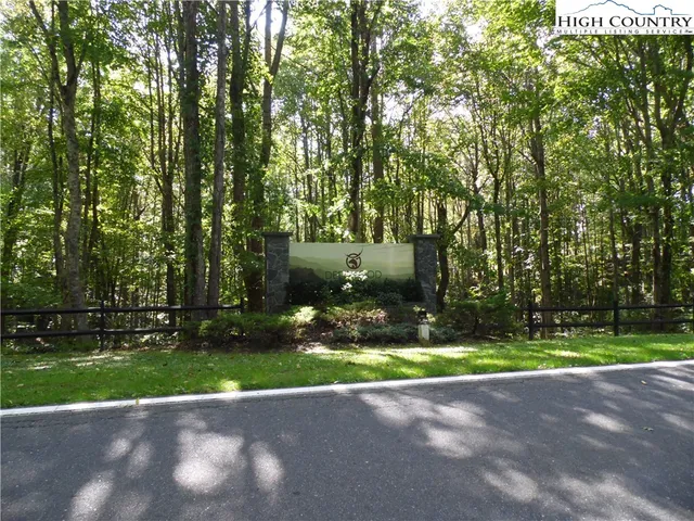a backyard of a house with yard and outdoor seating