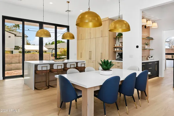 a kitchen with a table and chairs