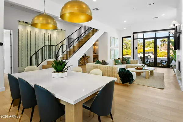 a dining room with furniture and window