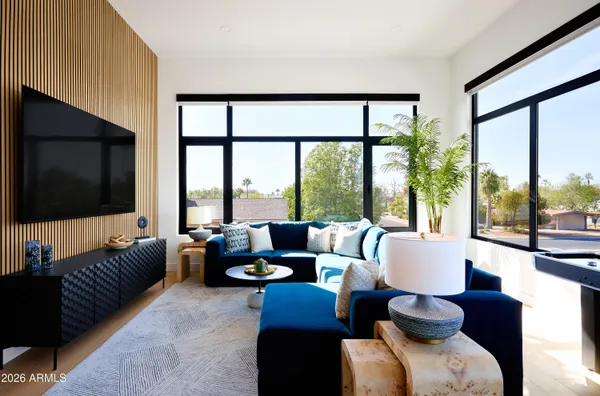 a living room with furniture and a large window