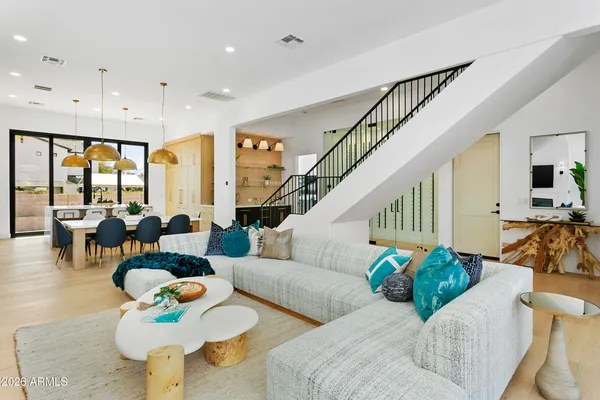 a living room with furniture and a table