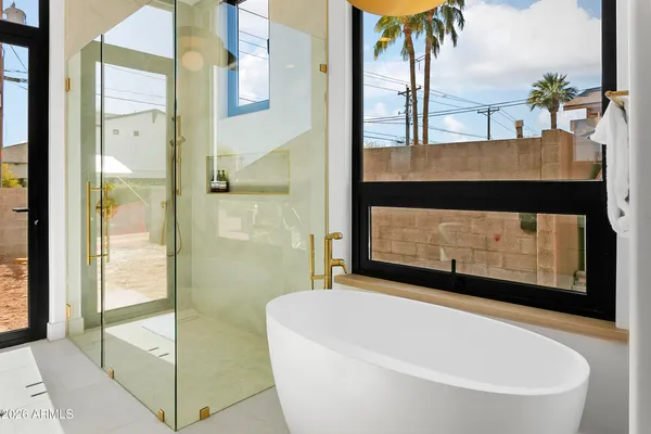 a bathroom with a shower and a tub