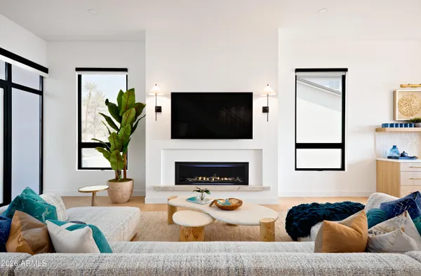 a living room with furniture and a fireplace
