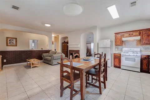 a view of a dining room with furniture and a fireplace