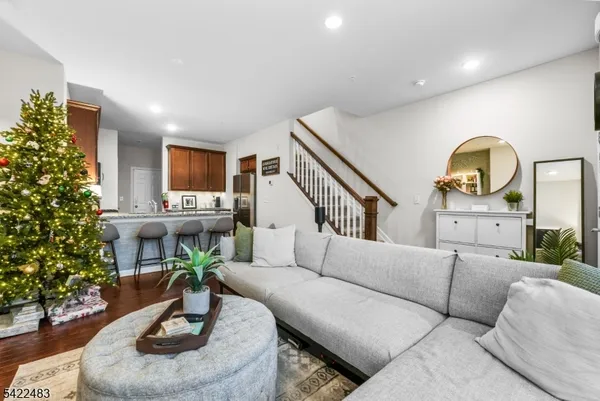 a kitchen with stainless steel appliances granite countertop a sink and a refrigerator