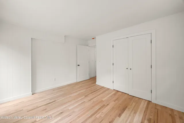 a view of room with wooden floor