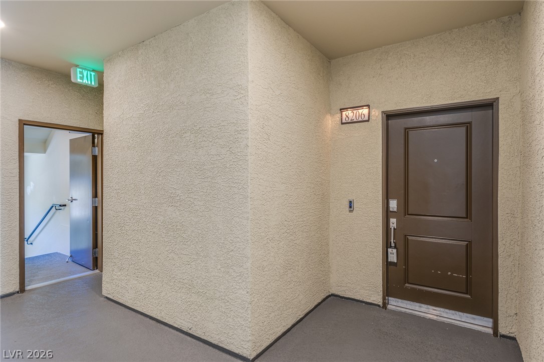 2555 Hampton Road, Unit 8206 Henderson, NV 89052 - Photo 22 of 25 Secure entrance leads to a private residential unit, highlighting practical living.