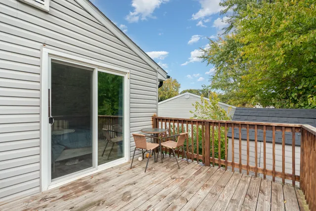 a view of a house with backyard porch and garden