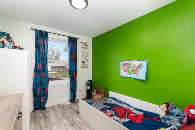 a room with toys and a wooden floor