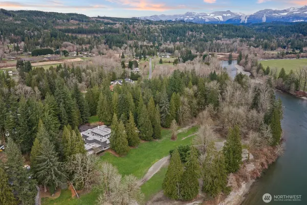a view of a city with lush green forest
