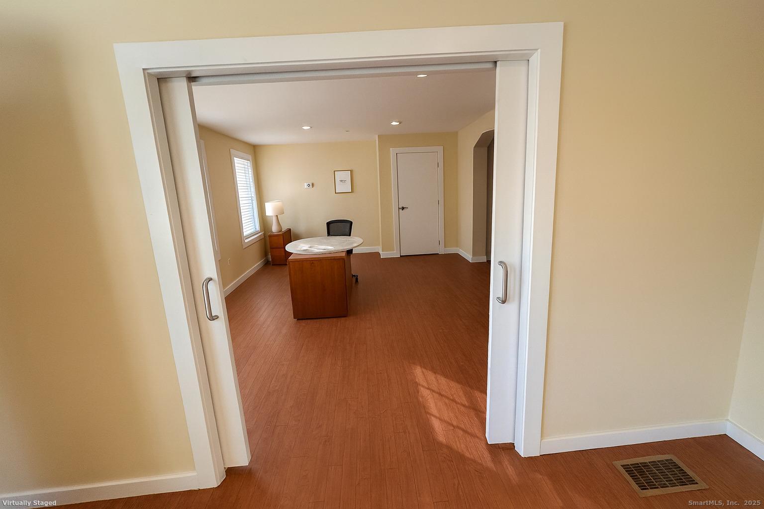 141 Valley Street New Haven, CT 06515 - Photo 15 of 30 a view of a hallway with wooden floor and furniture
