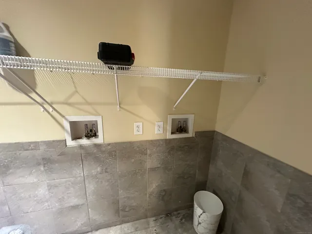 a bathroom with a shower and a toilet