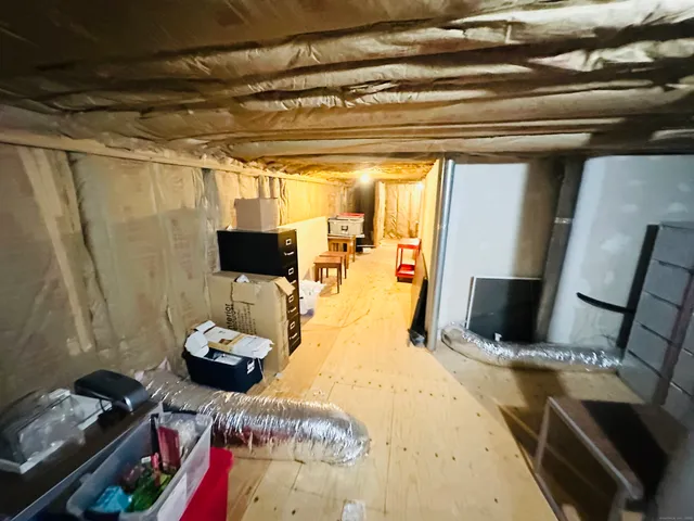 a view of a living room with furniture and a flat screen tv