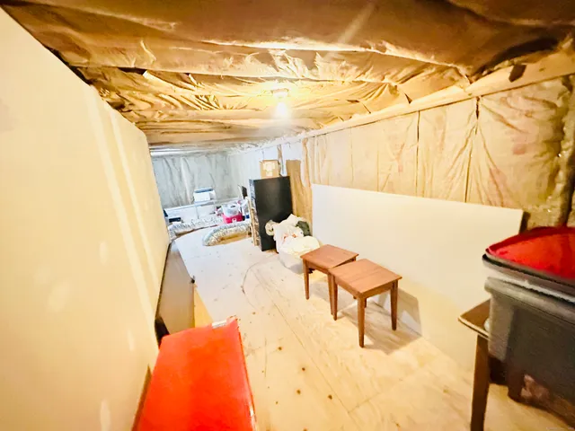 a balcony with table and chairs