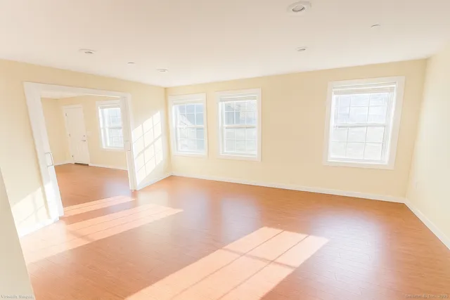 a view of an empty room with a window