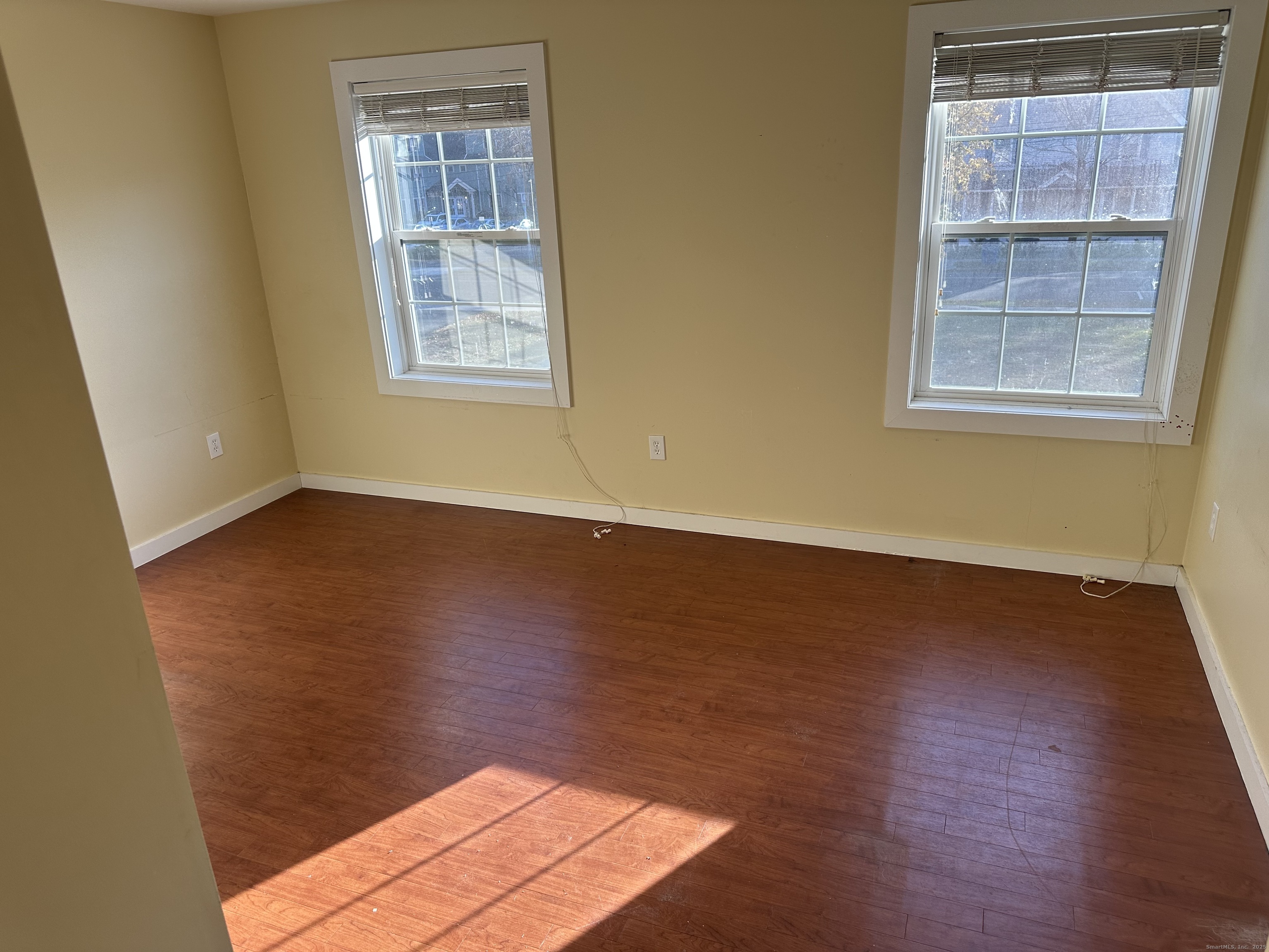 141 Valley Street New Haven, CT 06515 - Photo 9 of 30 a view of an empty room with wooden floor and a window