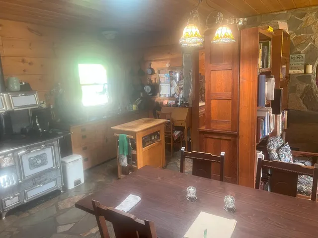 a kitchen with stainless steel appliances granite countertop a stove and a refrigerator