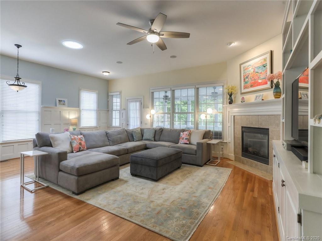 899 Stratford Run Drive Fort Mill, SC 29708 - Photo 17 of 48 a living room with furniture a window and a fireplace