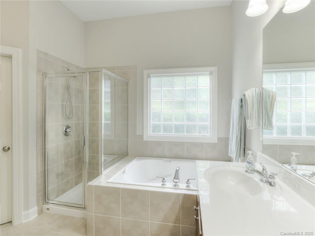 899 Stratford Run Drive Fort Mill, SC 29708 - Photo 28 of 48 a bathroom with a tub sink and mirror