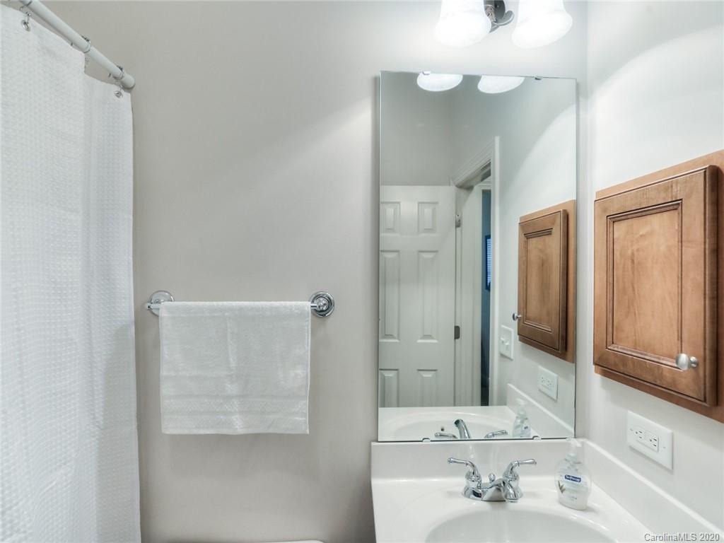 899 Stratford Run Drive Fort Mill, SC 29708 - Photo 37 of 48 a bathroom with a sink a mirror and a shower