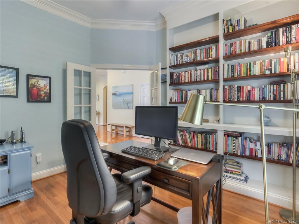 899 Stratford Run Drive Fort Mill, SC 29708 - Photo 7 of 48 a view of a workspace with furniture and a bookshelf