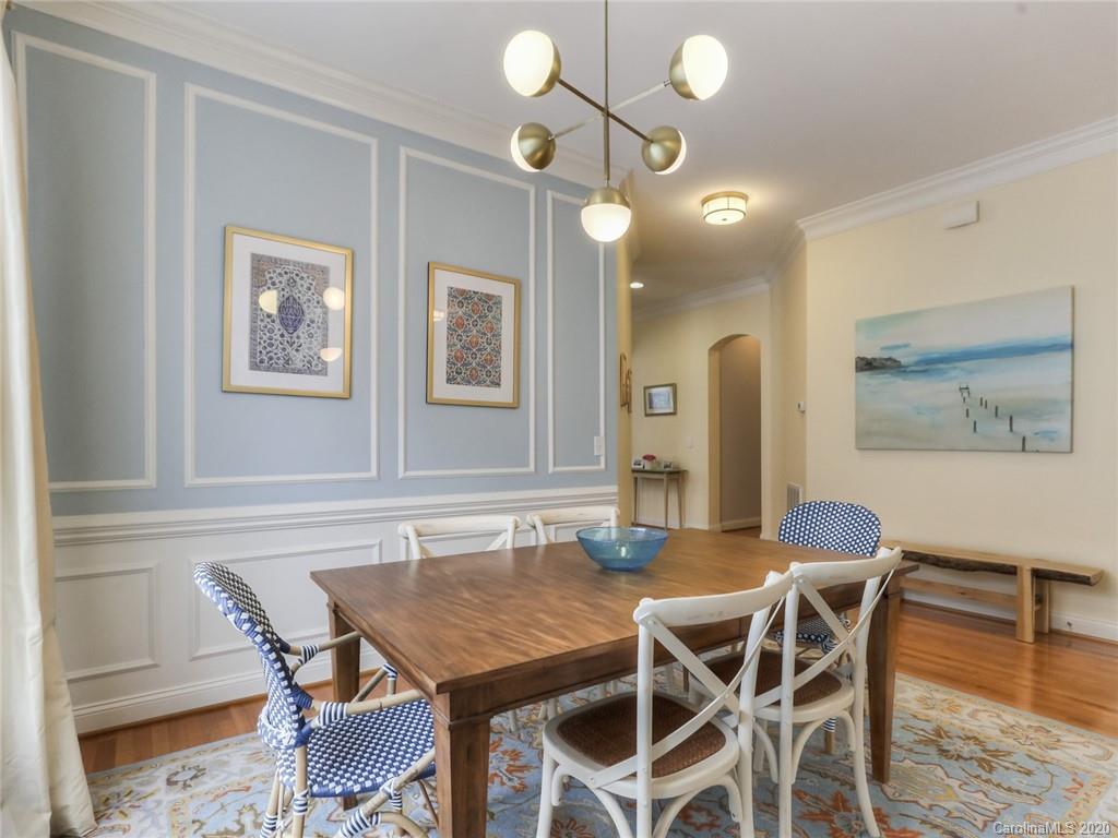 899 Stratford Run Drive Fort Mill, SC 29708 - Photo 10 of 48 a view of a dining room with furniture and wooden floor