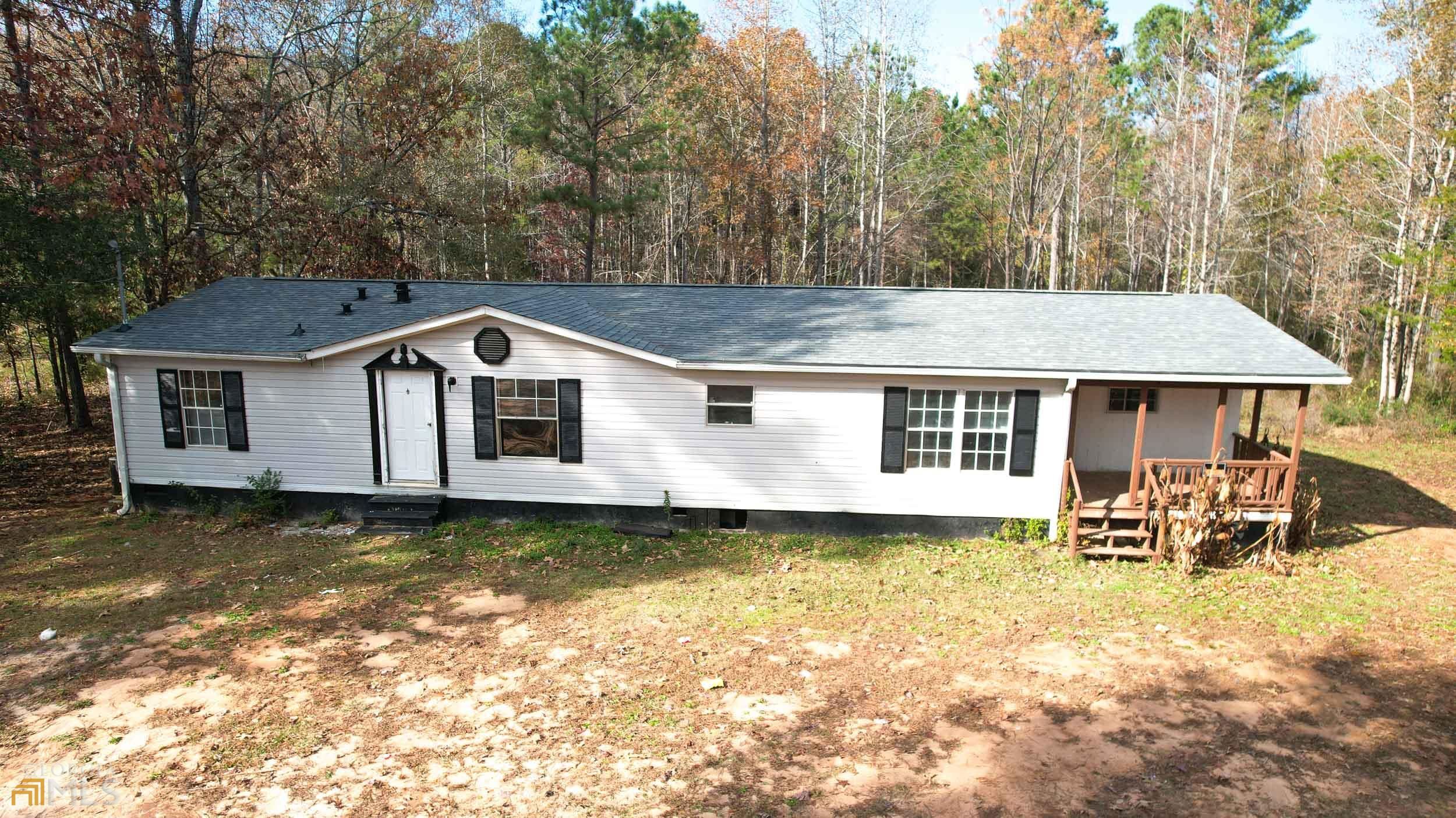 4355 High Falls Road Jackson, GA 30233 - Photo 1 of 1 a front view of a house with a yard glass top table and chairs