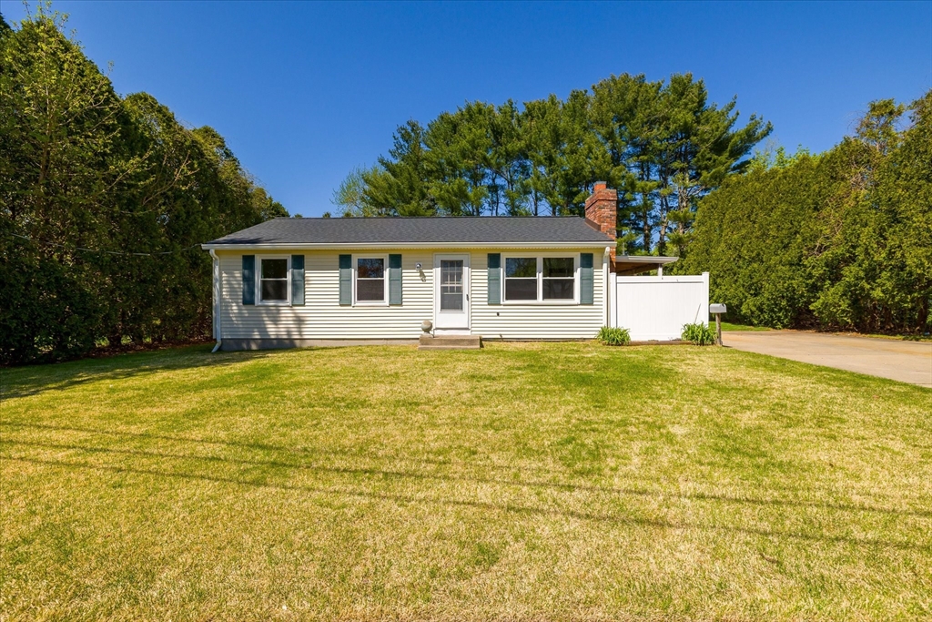 32 Bayberry Road Woonsocket, RI 02895 - Photo 1 of 26 a front view of a house with a garden