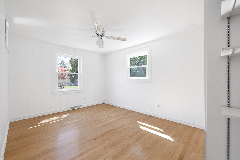 32 Bayberry Road Woonsocket, RI 02895 - Photo 13 of 26 wooden floor in an empty room with a window