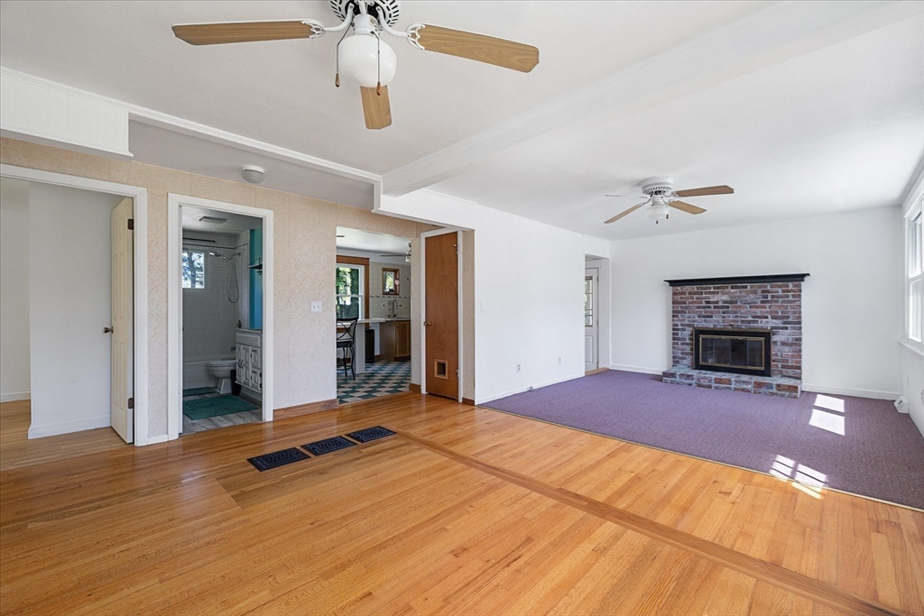 32 Bayberry Road Woonsocket, RI 02895 - Photo 2 of 26 a bedroom with a bed and a fireplace