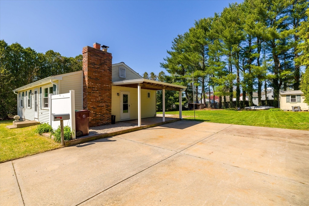 32 Bayberry Road Woonsocket, RI 02895 - Photo 23 of 26 a front view of a house with garden