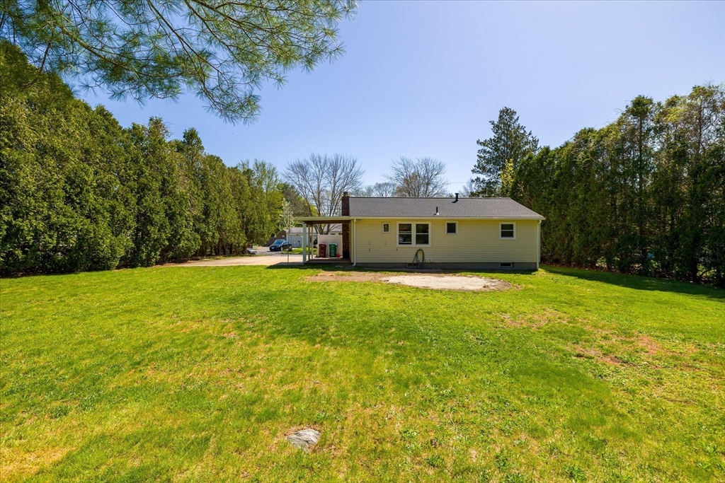 32 Bayberry Road Woonsocket, RI 02895 - Photo 25 of 26 a front view of a house with yard and trees