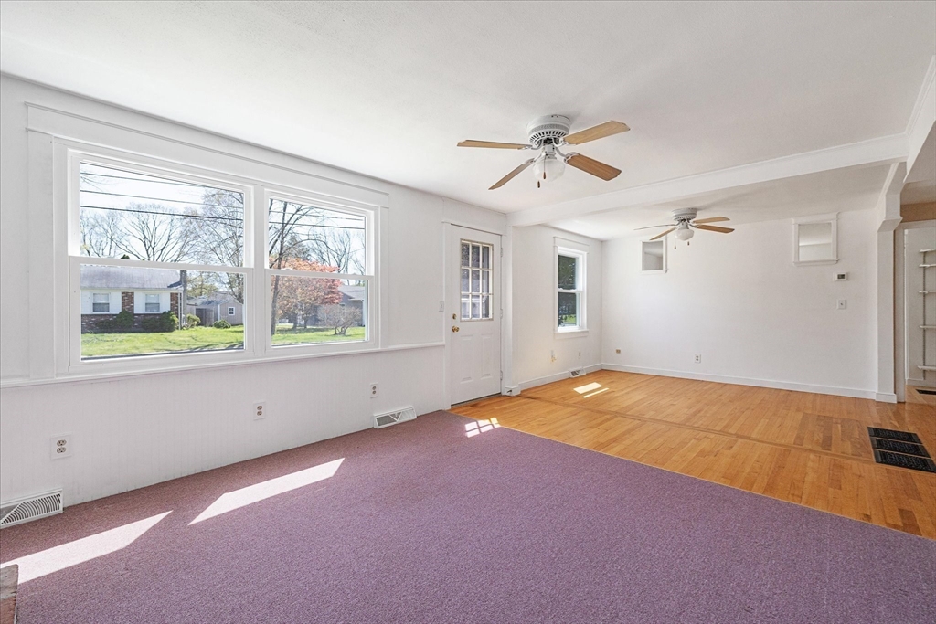 32 Bayberry Road Woonsocket, RI 02895 - Photo 9 of 26 a view of empty room with windows and ceiling fan