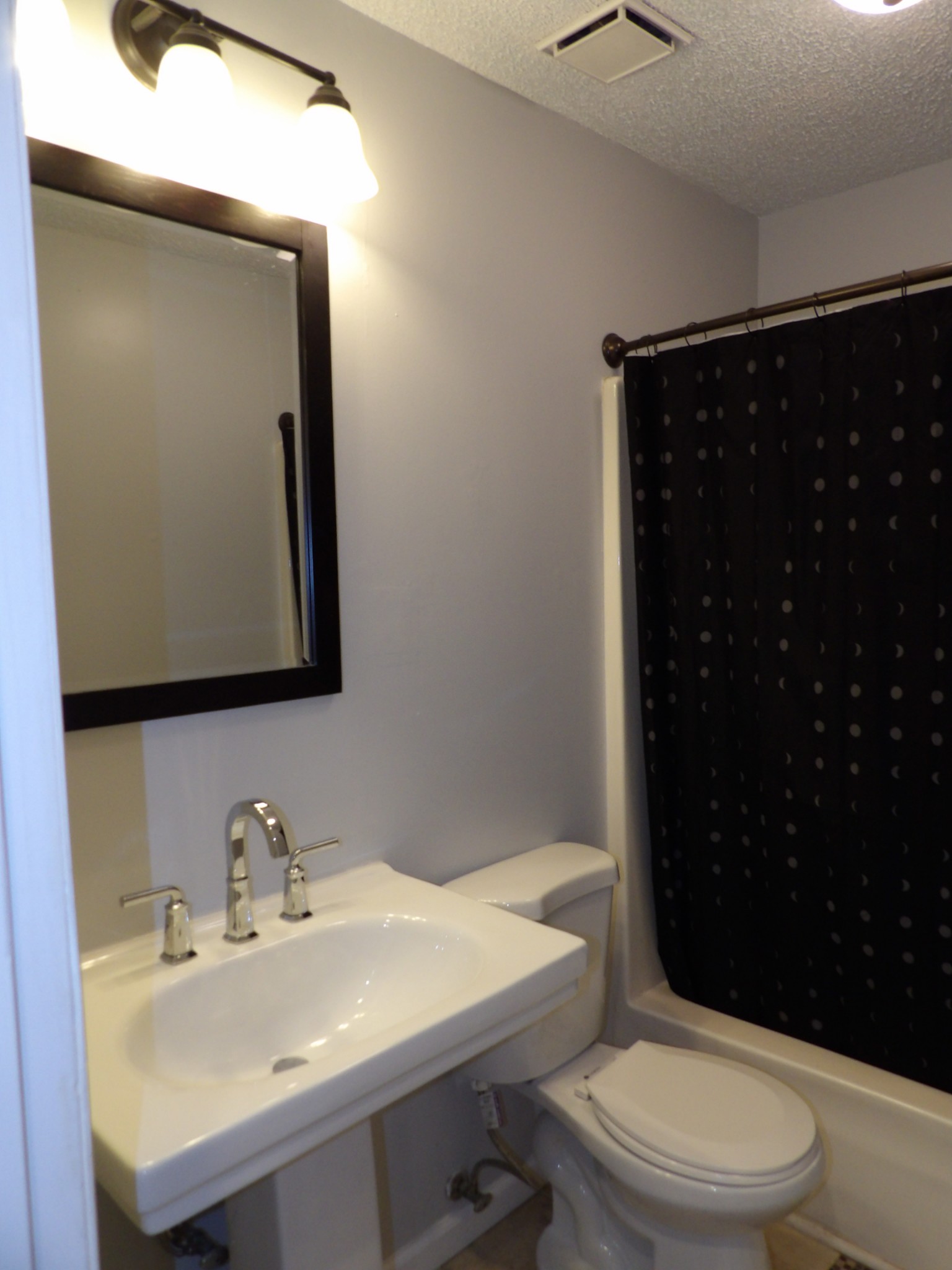 317 Cedarcliff Road Antioch, TN 37013 - Photo 21 of 31 a bathroom with a sink a toilet and mirror