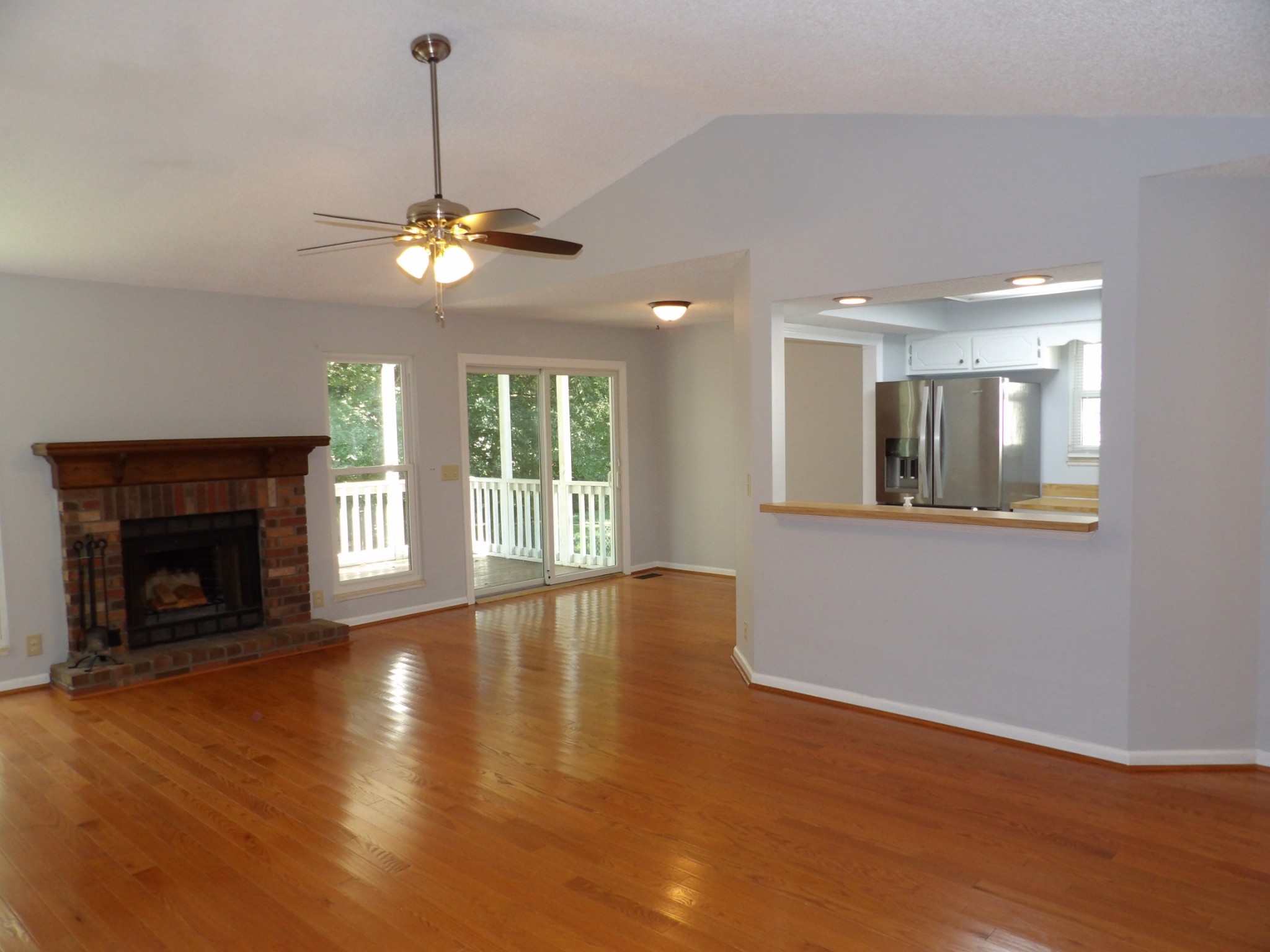 317 Cedarcliff Road Antioch, TN 37013 - Photo 6 of 31 a view of an empty room with window and wooden floor