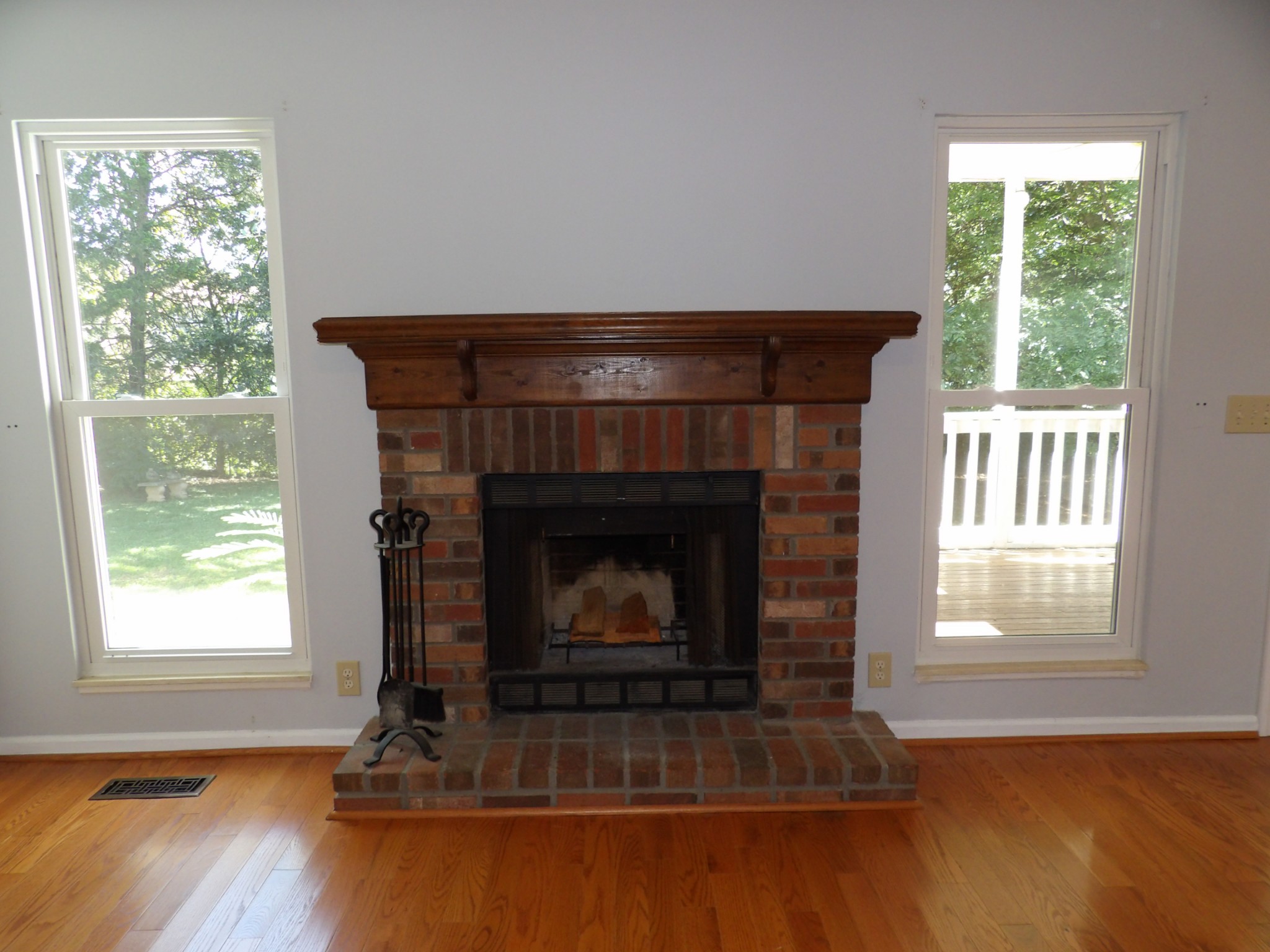 317 Cedarcliff Road Antioch, TN 37013 - Photo 7 of 31 a living room with fireplace and wooden floor