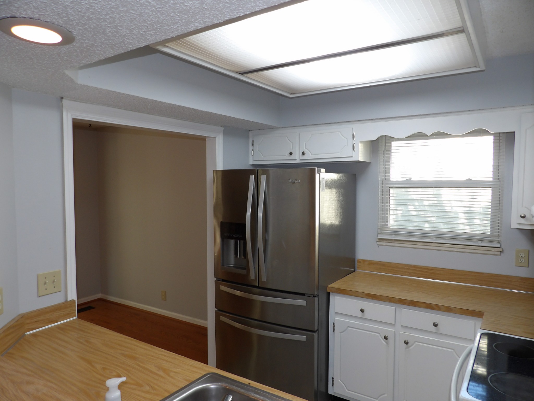 317 Cedarcliff Road Antioch, TN 37013 - Photo 8 of 31 a empty room with wooden floor and a window