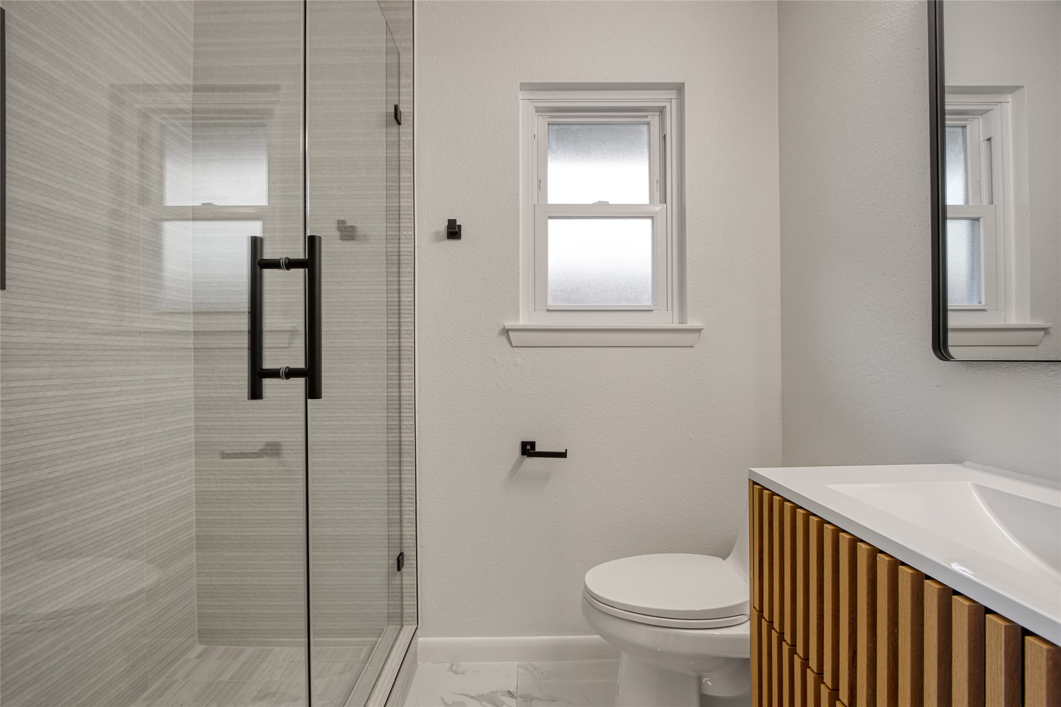 5802 Chrystell Lane Houston, TX 77092 - Photo 11 of 17 a bathroom with a toilet and a sink