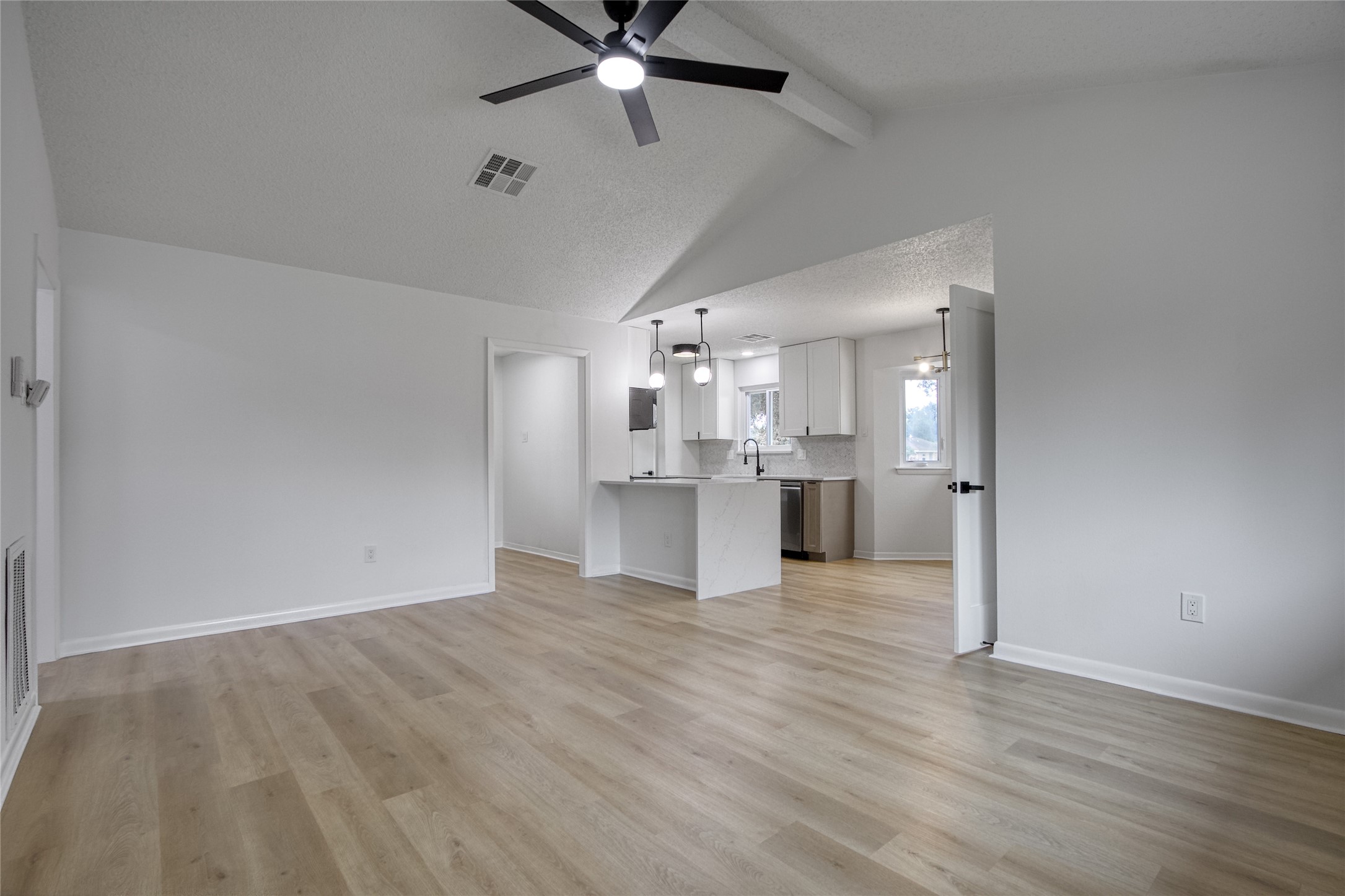 5802 Chrystell Lane Houston, TX 77092 - Photo 6 of 17 a view of a kitchen with a sink and a refrigerator