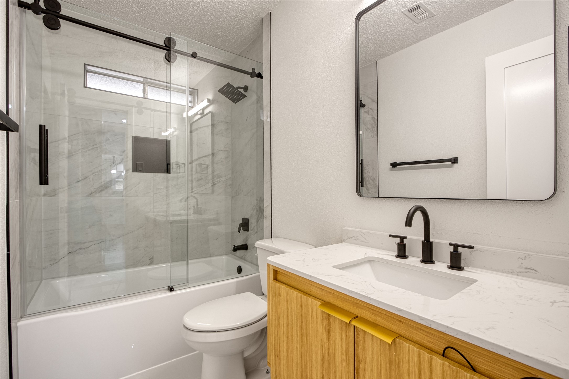 5802 Chrystell Lane Houston, TX 77092 - Photo 8 of 17 a bathroom with a sink a toilet and shower