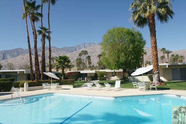 1855 Ramon Road, Unit 29 Palm Springs, CA 92264 - Photo 8 of 24 a view of a swimming pool with a patio and a yard