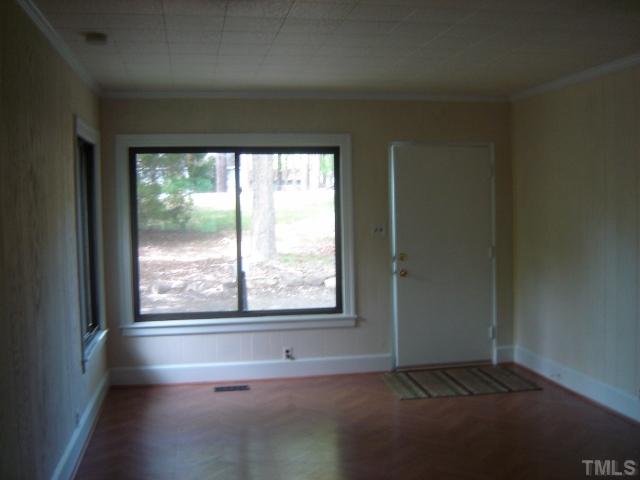 3510 Cheek Road Durham, NC 27704 - Photo 4 of 5 a view of an empty room and window